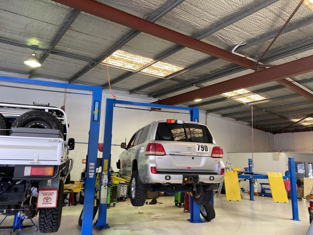 Auto repair shop interior with tools and lifts